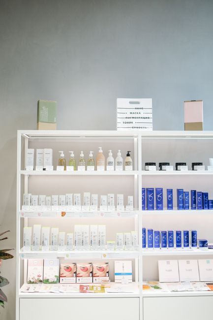 Well-organized skincare product display on shelves in a store setting.